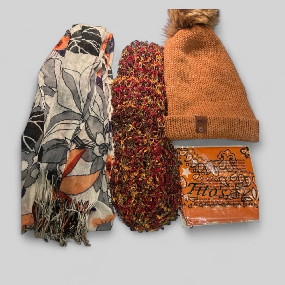 Beautiful bundle of ladies cozy accessories in autumn earth tones scarves hat